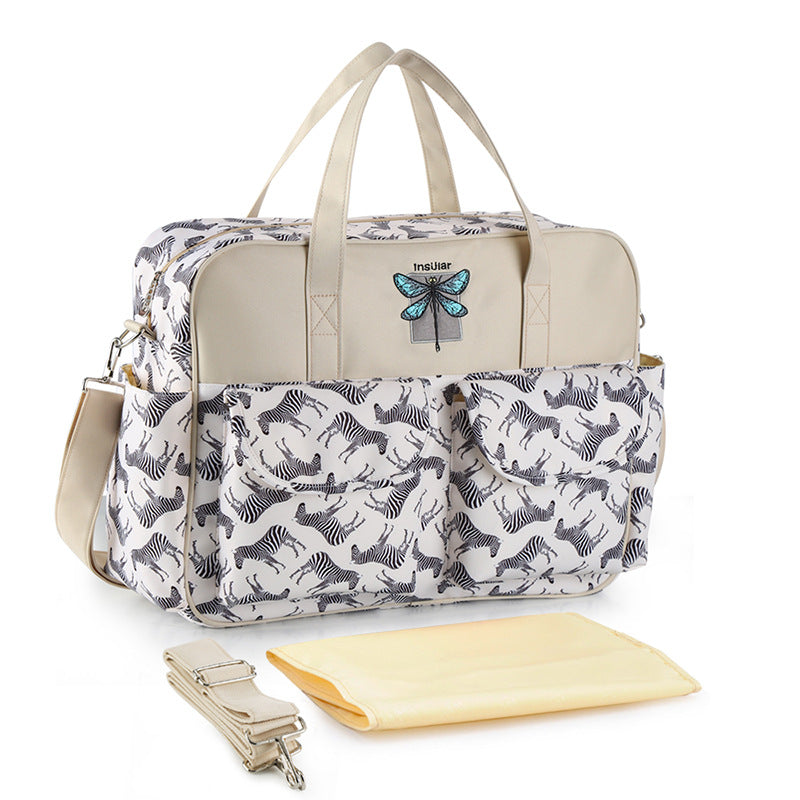 Diaper bag with zebra pattern and butterfly design on a white background