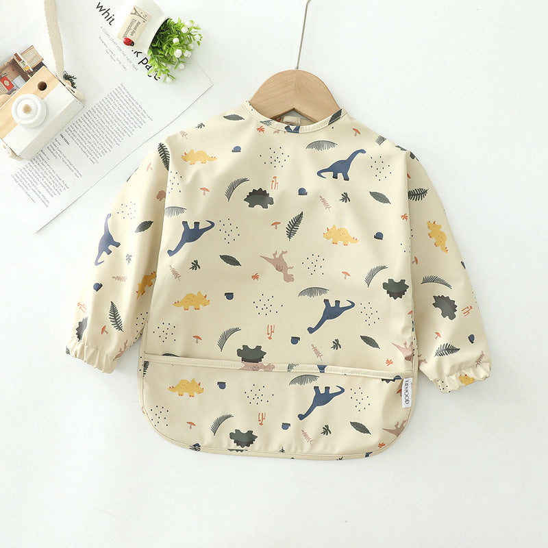 Children's apron with dinosaur pattern on a white background