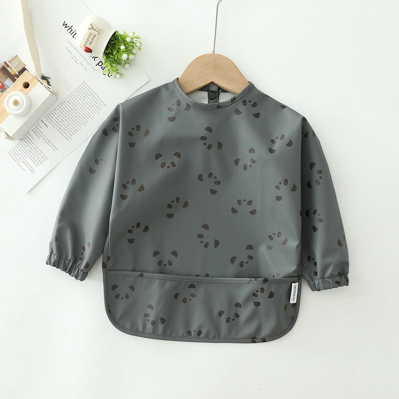 Gray children's bib with black pattern on a white background
