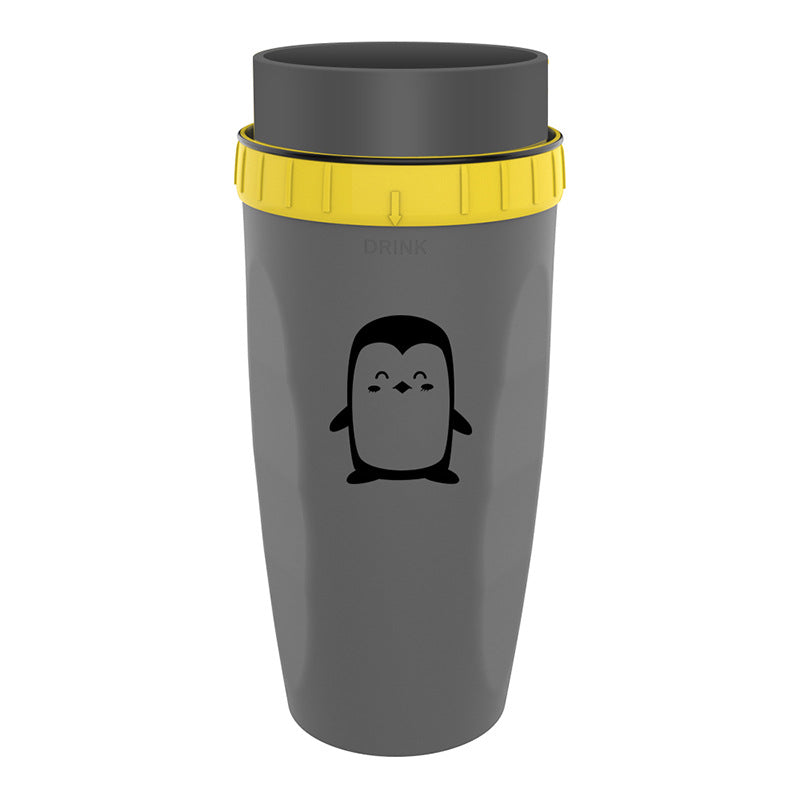 Gray tumbler with yellow lid and penguin design on a white background