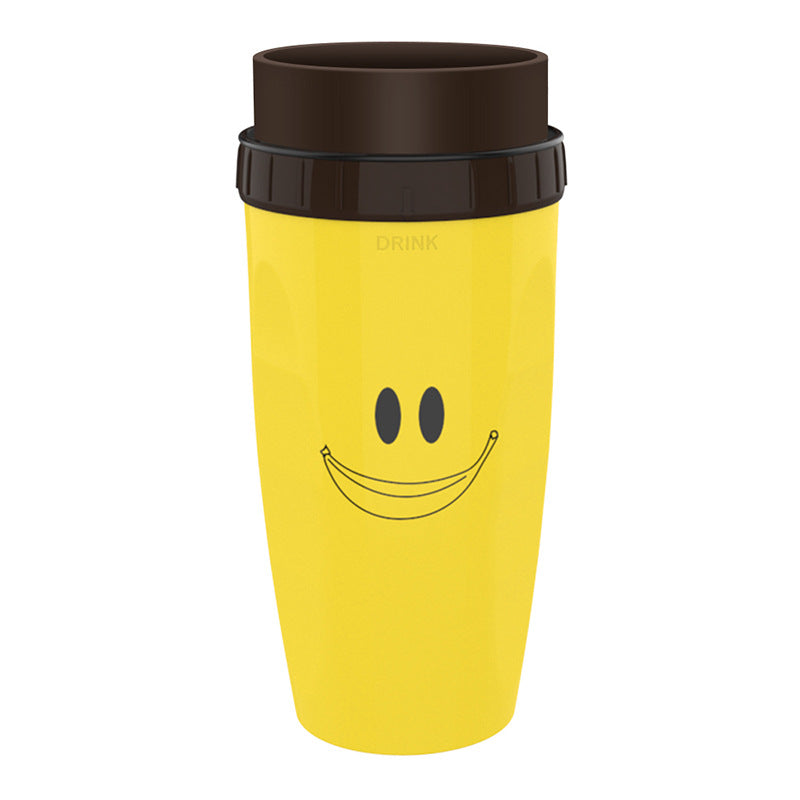 Yellow travel mug with a smiley face design on a white background