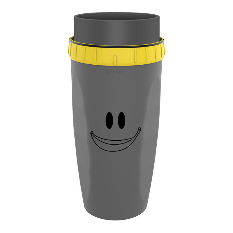 Gray tumbler with a smiley face design and yellow lid on a white background