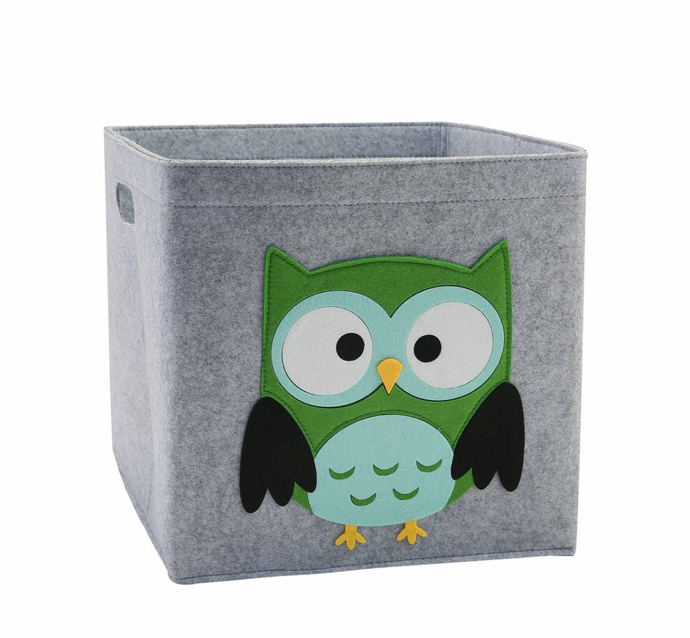 Gray storage cube with a green owl design on a white background
