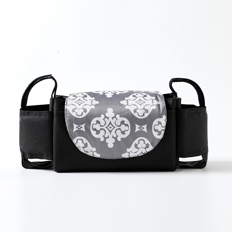 Black bag with a gray patterned flap on a white background