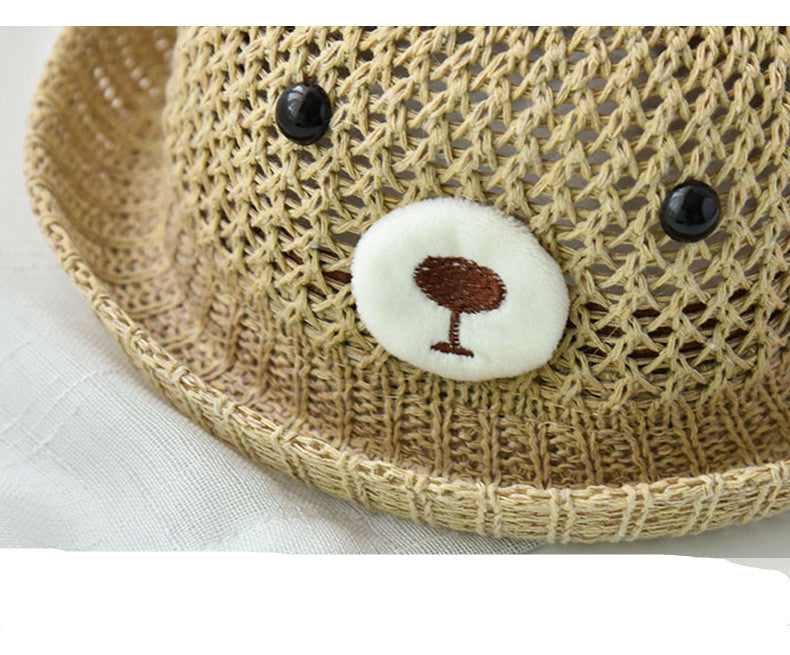 Woven hat with a face design on a white background