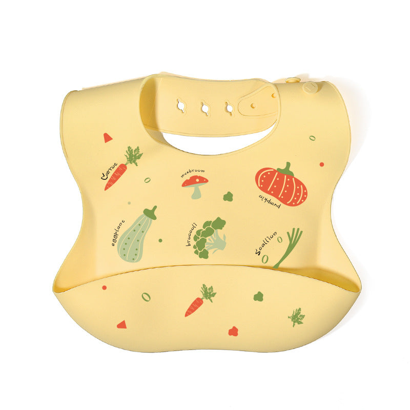 Yellow bib with vegetable illustrations on a white background