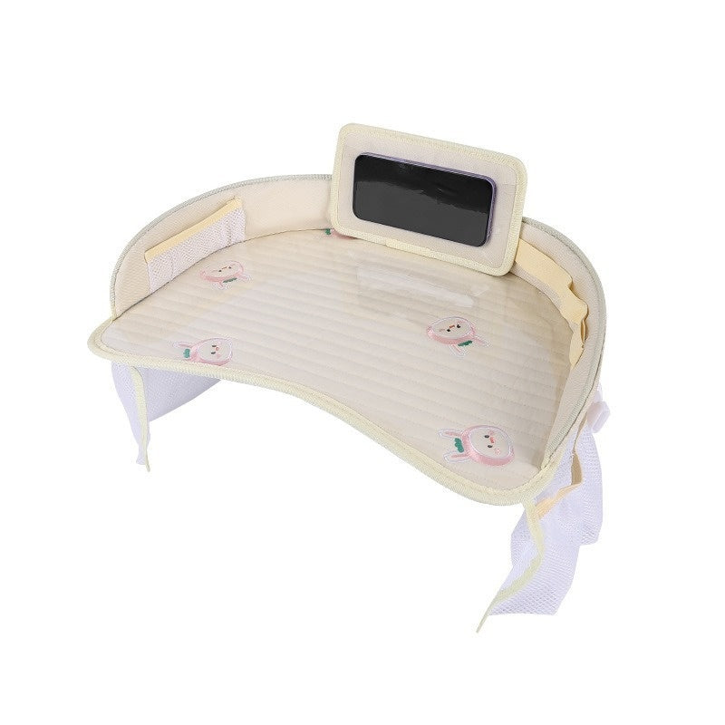 A cream-colored kids travel tray with a ribbed quilted surface and cute print, shown on a solid white background.