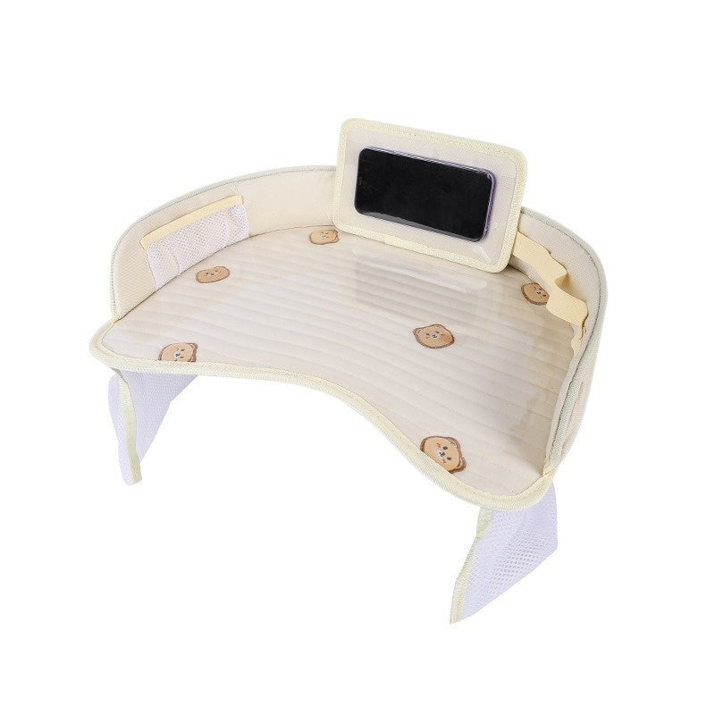 A cream-colored kids travel tray with a ribbed quilted surface and cute print, shown on a solid white background.