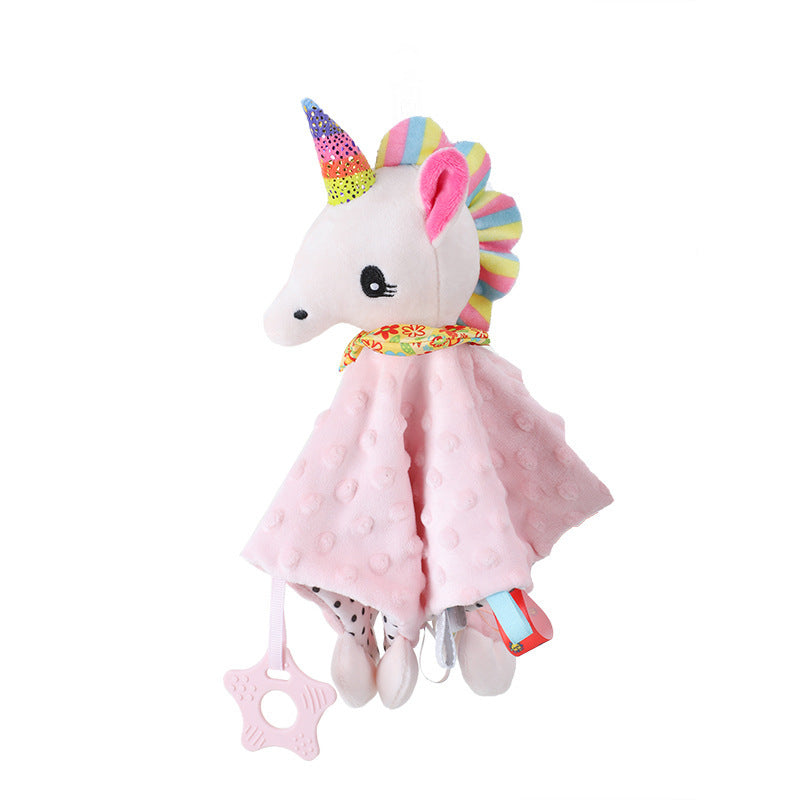 Unicorn plush toy with pink blanket and rainbow horn on a white background