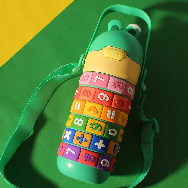 Colorful water bottle with textured surface on a green and yellow background