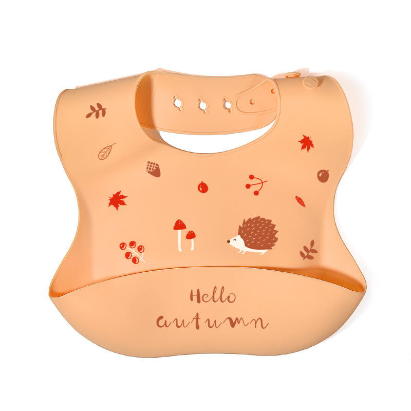 Baby bib with autumn-themed design on a white background