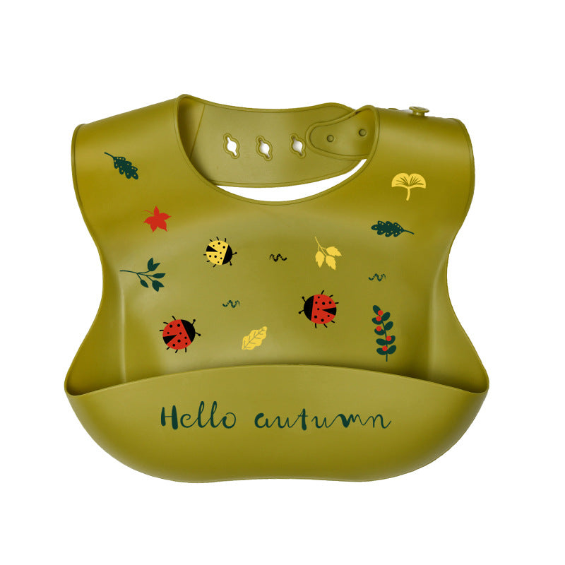 Green bib with autumn-themed illustrations on a white background