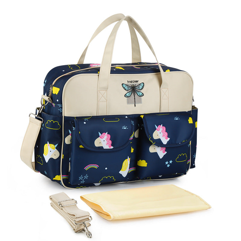 Navy blue diaper bag with unicorn and rainbow pattern on a white background