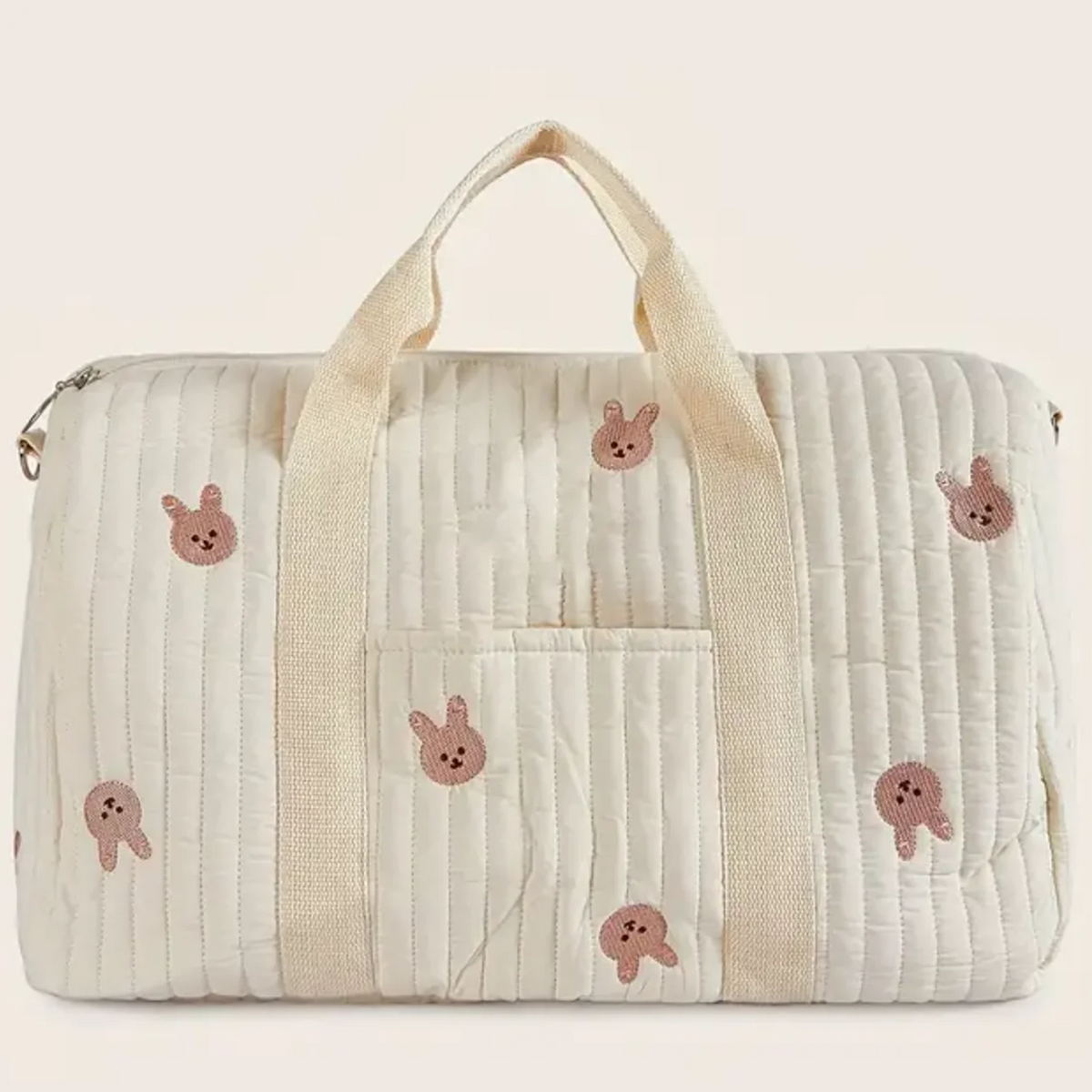 Quilted bag with cartoon character patches on a light background