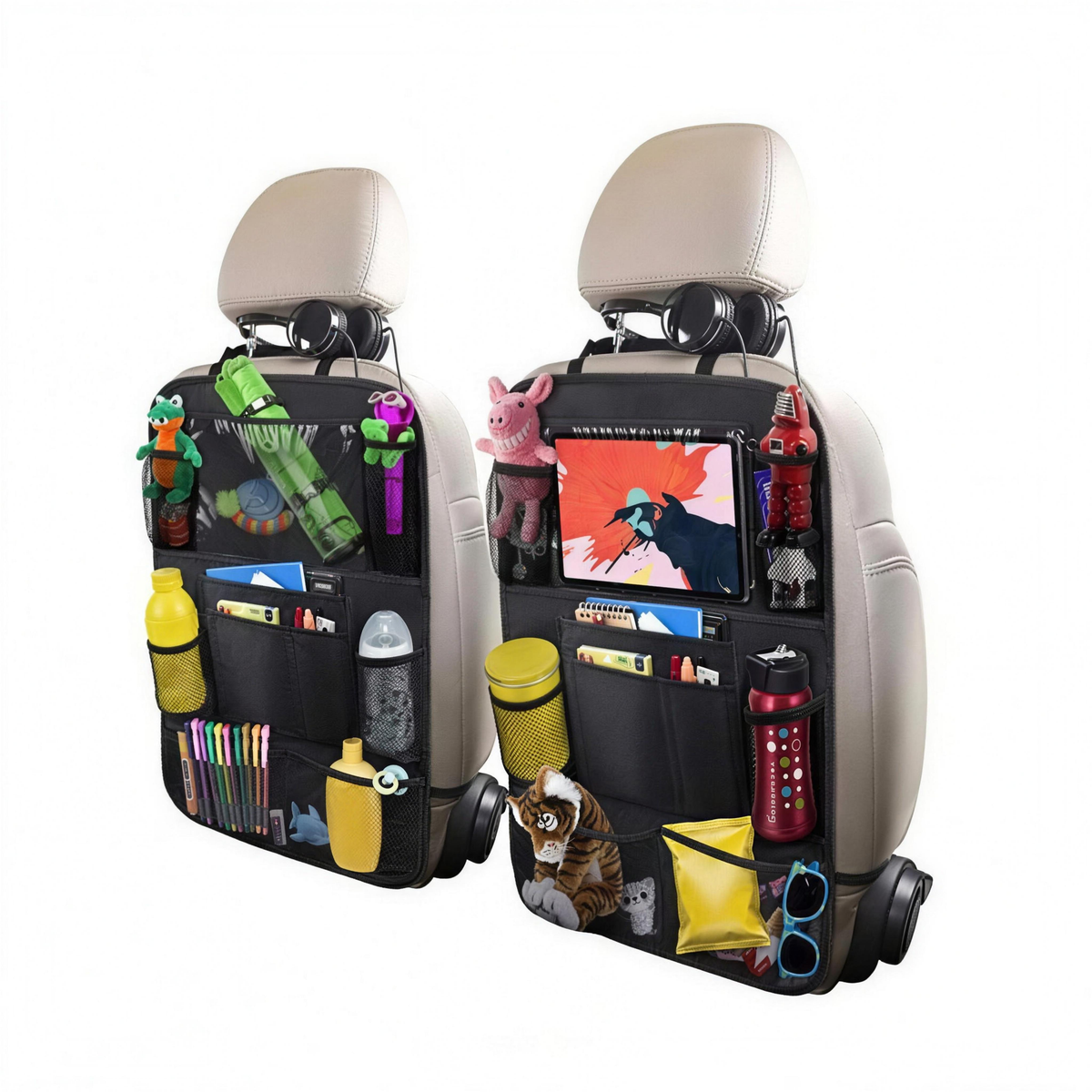 Two black car seat organizer bags hanging from beige headrests, filled with toys, bottles, books, and other household items on a plain white background.
